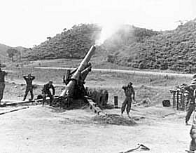 Photo:  An 8-inch howitzer is fired by members of Battery A, 17th FA Bn., 45th U.S. Inf. Div., north of Yonchon, Korea.