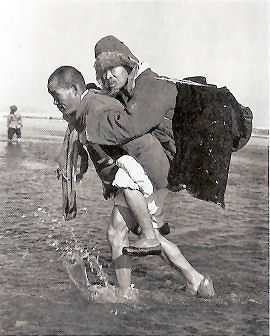 Aged Refugee Carried Across the Han River south of Seoul, January 1951