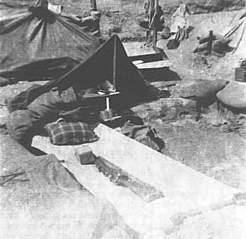 Ptes E. R. Holden and and Spike Watson 10 Plt. D Coy, air out their 2 man tent, Kansas Line, April, 1953