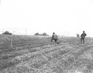 Photo:  Men of the 3rd U.S. Rangers, 3rd Infantry Division, advance north of the Imjin River.