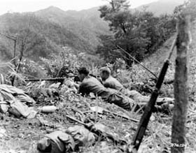 Photo:  Cpl. Bill Miller of Trenton, New Jersey, and Sgy. Clifford Meli of Jamestown, New York, members of Company 