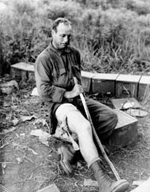 Photo:  1st Lt. Dowll Hudson, Co. C, 1st Battalion, 38th Infantry Regiment, stops to rest on his way to the aid station. 