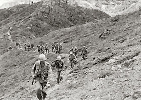 Photo:  Company F, 9th Infantry, advances in central Korea.