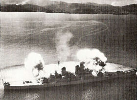 Photo:  Battleship New Jersey blasts enemy positions about at the 38th Parallel.