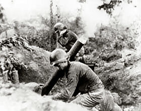 An American mortar crew fires on the Communist North Korean invaders.