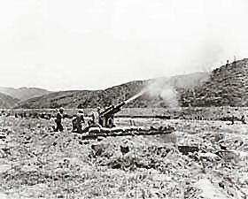 A 105-mm howitzer in action against the Communist-led North Korean invaders, somewhere in Korea.