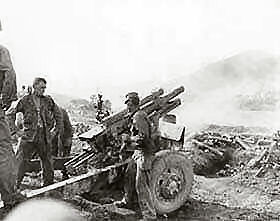 105-mm howitzer in action against the Communist-led North Korean invaders.