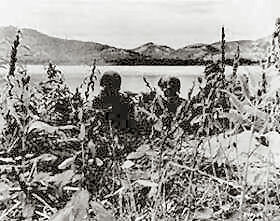 Men of the 5th RCT fire a .30 caliber machine gun at the Communist-led North Koreans across the Naktong River, north of Taegu.