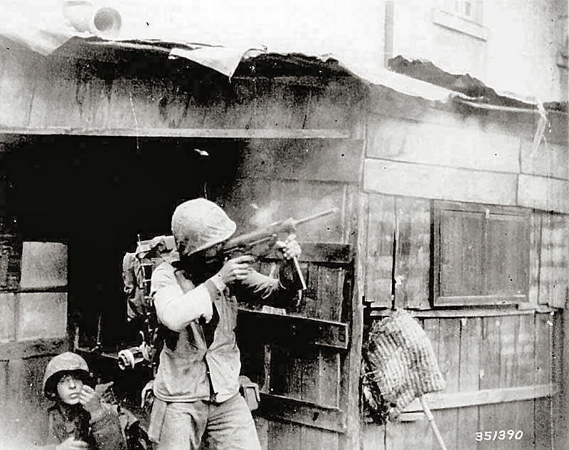 US Marine uses M3A1 Grease Gun with 30 Round Magazine to suppress snipers