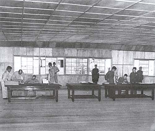 Photo: Lt. Gen. William K. Harrison, Jr., U.S. Army and Lt. Gen. Nam Il, North Korean People's Army, sign the armistice agreement.