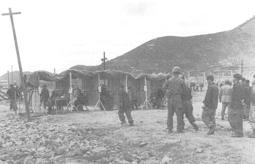 Photo: Repatriation screening of Communist POWs. 1952 (National Archives)