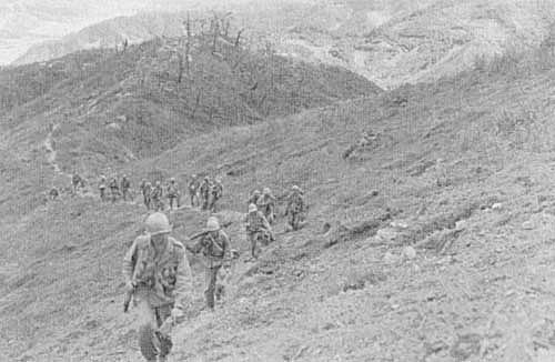 Photo: Company F, 9th Infantry, advances in central Korea