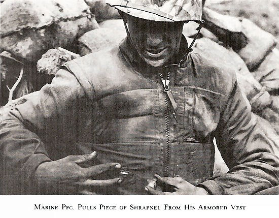 Marine Pfc. Pulls Shrapnel From His Armored Vest