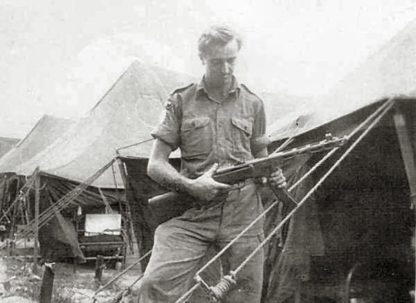  Keith Hasler holding captured Chinese burp-gun 3